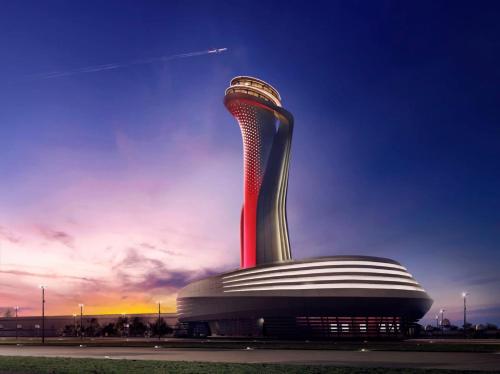 un edificio con una torre a spirale sopra di esso di Med Life Hotel İstanbul Airport a Arnavutköy
