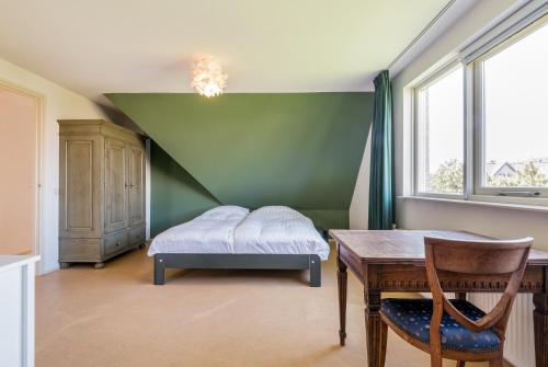 Postel nebo postele na pokoji v ubytování Villa Duin en Strand
