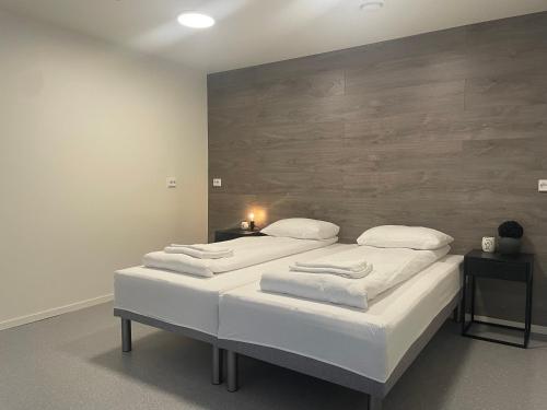 Postel nebo postele na pokoji v ubytování SamiCity Hotel As