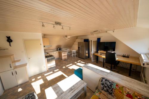 an overhead view of a kitchen and living room at Apartment Pirnat in Bohinj