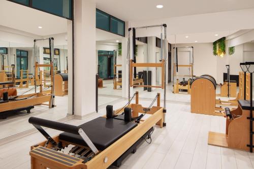 a gym with a row of mirrors and a machine at Sheraton Ankara Hotel & Convention Center in Ankara