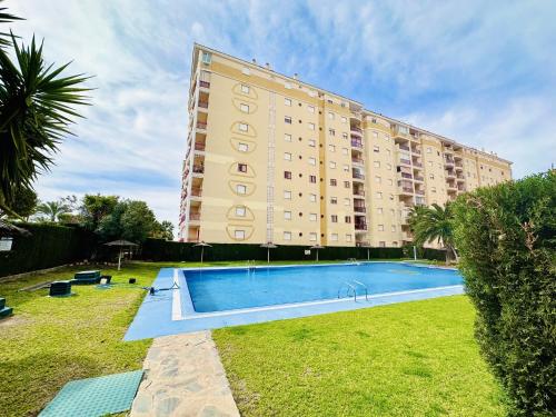 a large building with a swimming pool in front of it at A1040 - Terramar 1 - 2004 Finestrat in Villajoyosa