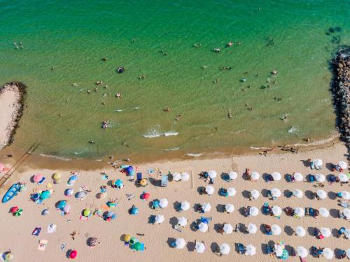 an overhead view of a beach with people and umbrellas at Grand Resort in Sveti Vlas