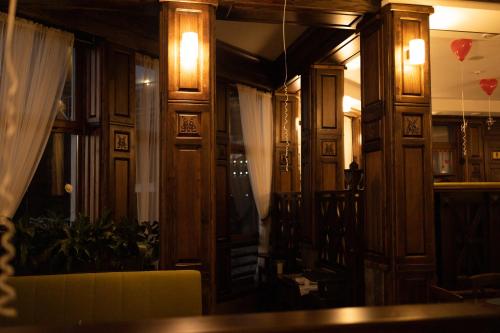 a room with wooden walls and a window and a table at Синевирський Перевал in Synevyr