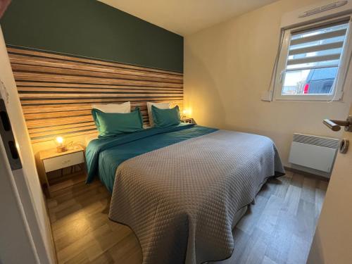 Ένα ή περισσότερα κρεβάτια σε δωμάτιο στο Lodge Starlette Spa privatif à Meisenthal