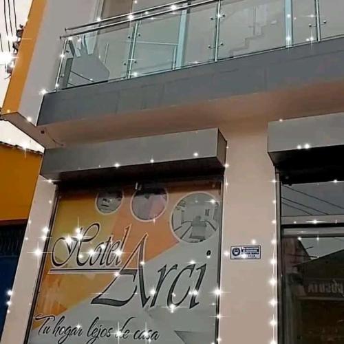 a store front with a sign for a store at Hotel Arci in Cúcuta