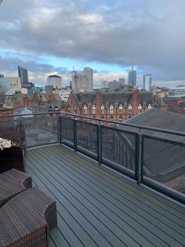 a balcony with a view of a city at 2 Bed duplex, close to Millennium Square in Leeds