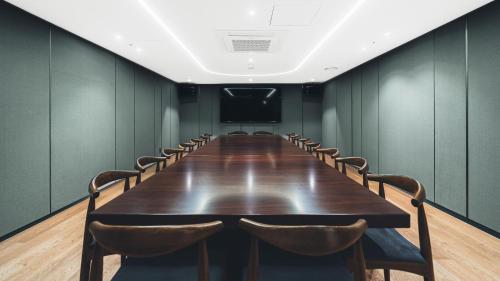a conference room with a long table and chairs at The Prima Hotel Jongno in Seoul