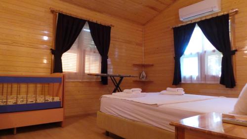 Postel nebo postele na pokoji v ubytování Mercan Bungalow