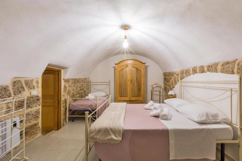 a bedroom with two beds in a room at Casa Relax in Mesagne