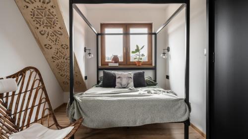 a bedroom with a bed with a mirror at Harendzianka in Zakopane