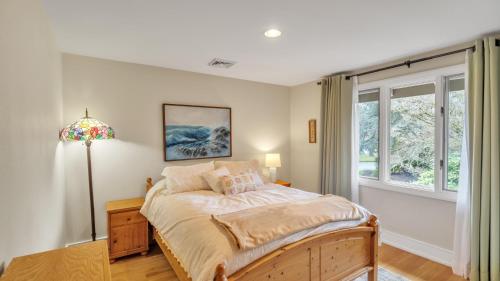 a bedroom with a bed and a window at Eugene - Close to everything home in Eugene