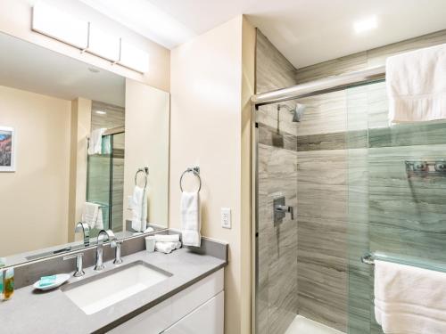a bathroom with a sink and a shower at Family Friendly Apartment Downtown in Stamford
