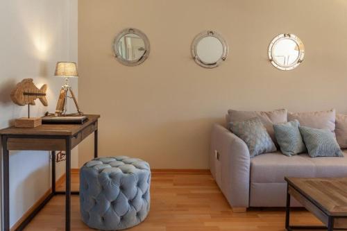 a living room with a couch and a table at Birdie mit Ostseeblick Haus Fore in Lohme