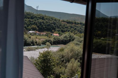 a view of a river from a window at Hotel Avdi Rexha in Kolgecaj