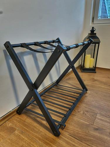 a metal object sitting on a wooden floor at Grand Blue 2 Bedroom Apartment Sokobanja in Soko Banja