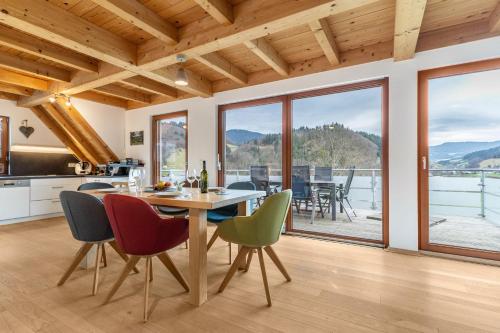 a kitchen and dining room with a table and chairs at Vorderbühlhof in Oppenau