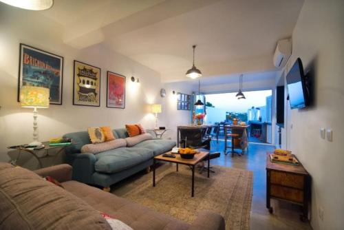 a living room with a couch and a table at Stylish town house in Silves in Silves