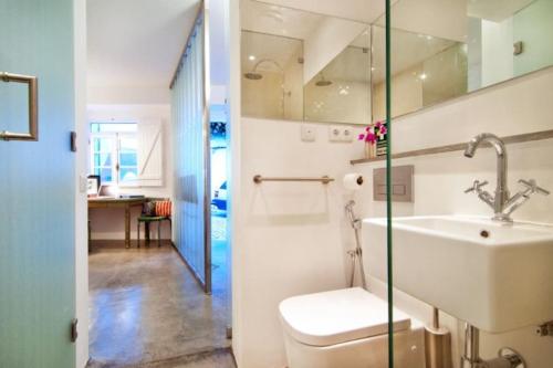 a bathroom with a sink and a toilet at Stylish town house in Silves in Silves