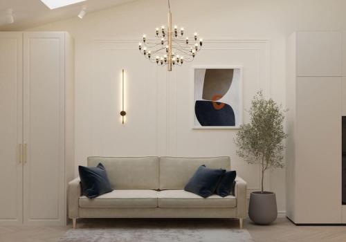 a living room with a couch and a chandelier at Strzelecka apartment in Kraków