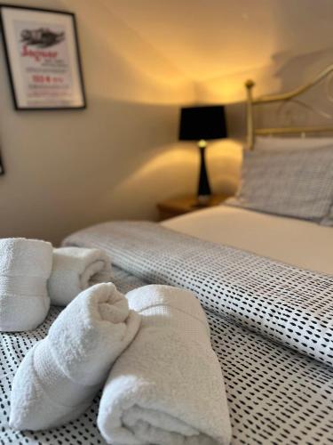 Katil atau katil-katil dalam bilik di Princetown Guesthouse
