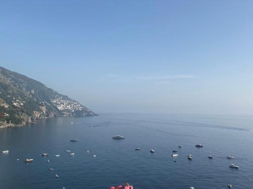 a group of boats in a large body of water at Palazzo Talamo in Positano