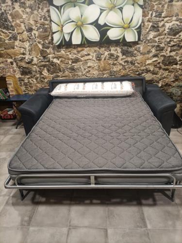 a mattress sitting in a room next to a wall at Casa Elvi in Gijón