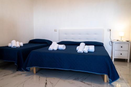 Un ou plusieurs lits dans un hébergement de l'établissement App Tirreno