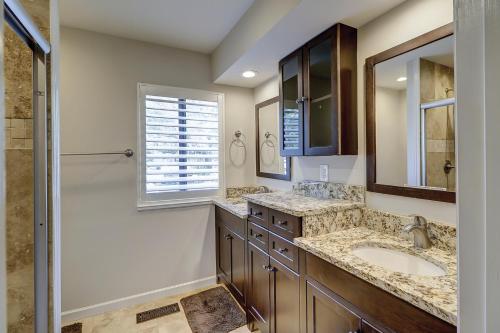 a bathroom with two sinks and a shower at Beachwalk 150 in Hilton Head Island