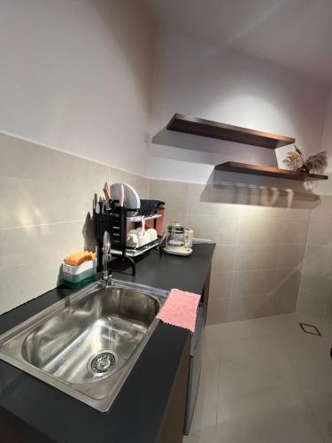 a kitchen with a sink and a counter at THE SHORE KOTA KINABALU 5Pax Family Room in Kota Kinabalu