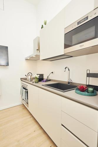 Suite Sanzio 14 - monolocale vicino a Fiera Milano City e Stadio