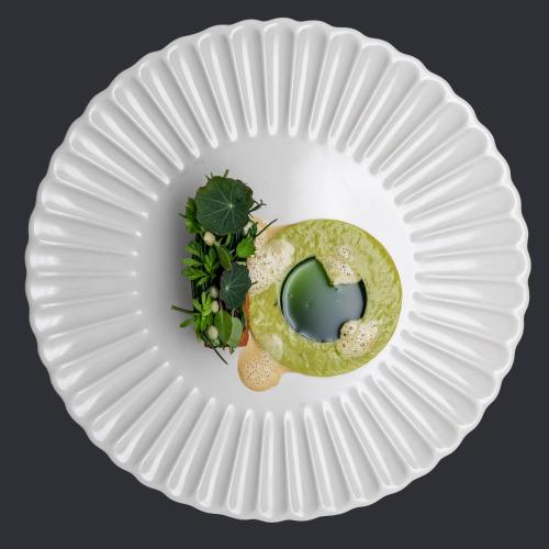 a white paper plate with a donut on it at LUGANODANTE Boutique & Lifestyle Hotel in Lugano
