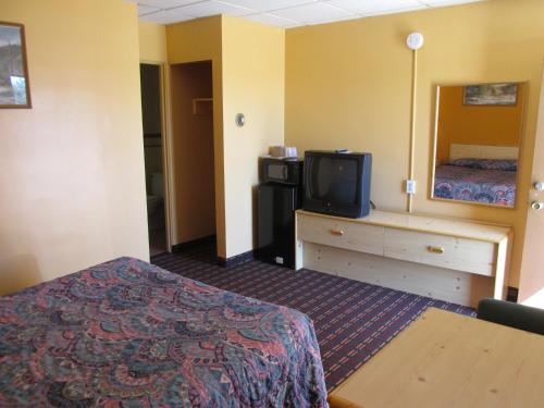 Ein Bett oder Betten in einem Zimmer der Unterkunft Motel 7 Rawlins
