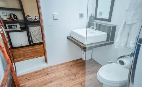 a bathroom with a sink and a toilet at Holiday Home Kelaa Retreat in Kelaa