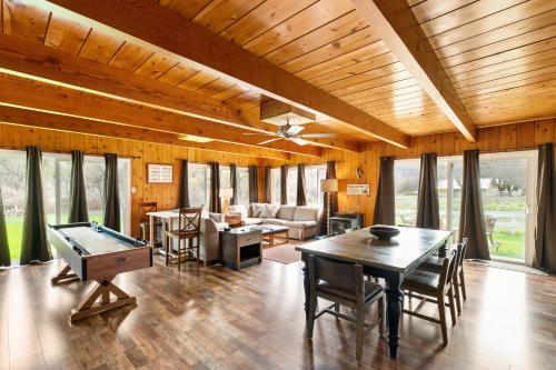 a living room with a ping pong table at Indian Creek Lodge in Douglas City