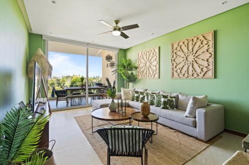 a living room with a couch and a table at Stylish Peninsula Golf 3BR Oasis with Pool in Nuevo Vallarta