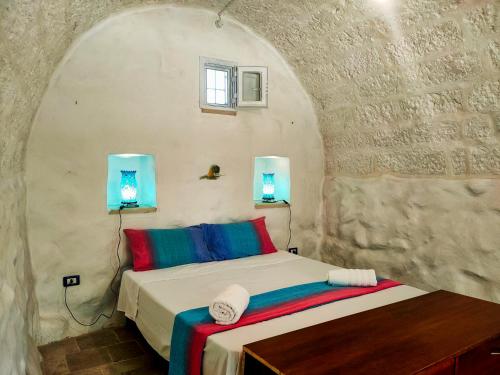 Ένα ή περισσότερα κρεβάτια σε δωμάτιο στο Il Carrubo di Casa Camilla Journey