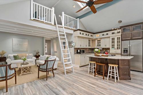 a kitchen and living room with a ladder in a house at Guilford Carriage House at Granite Lodge! in Guilford