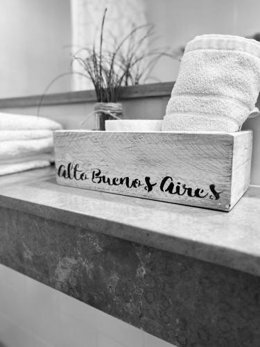 a sign that says air flowers and ashes on a bathroom counter at Alto Buenos Aires in Buenos Aires