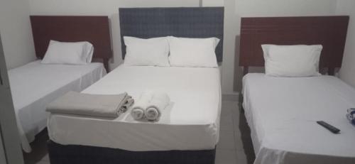 Una cama o camas en una habitación de HOTEL PARAACO