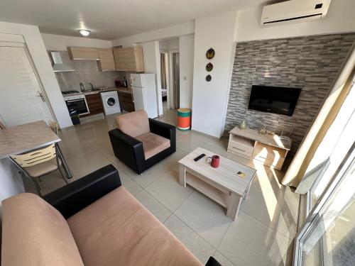 a living room with a couch and a table at Kyrenia center, 2 bedroom, 1 living room, residential apartment in Kérynia