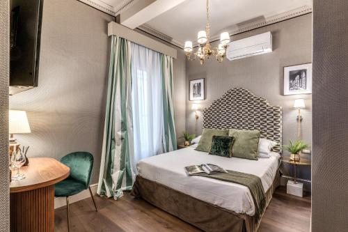 Un pat sau paturi într-o cameră la Antica Residenza Del Corso