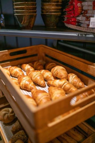 a tray of loaves of bread in a bakery at Stadshotel Heerlen in Heerlen