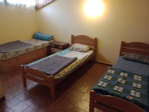 Ένα ή περισσότερα κρεβάτια σε δωμάτιο στο Casa ABUELO WILSON Santa Teresita