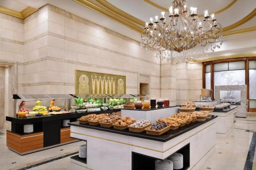 a buffet line with many different types of food at InterContinental Dar Al Hijra Madinah by IHG in Al Madinah