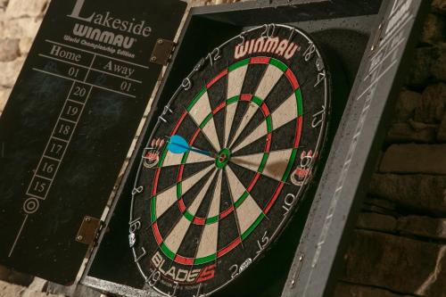 a dartboard on top of a brick wall at Slaley Hall Hotel, Spa & Golf Resort in Slaley