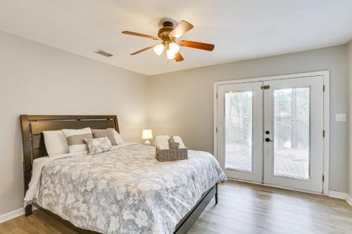 a bedroom with a bed and a ceiling fan at Updated Tallahassee Townhome 3 Mi to Downtown! in Tallahassee