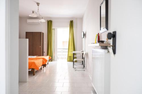 a room with a bed and a dining room at Dimitris City Break Apts in Chania Town