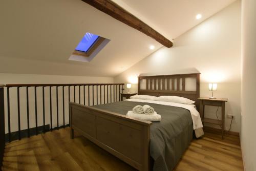 a bedroom with a bed with two towels on it at XX Miglia apartments in Catania