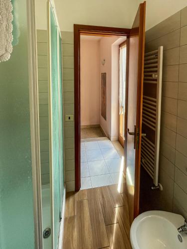 a bathroom with a toilet and a sink at La Piazzetta in Torella deʼ Lombardi